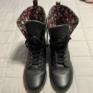 Black Dr. Martens boots with floral designs on inside